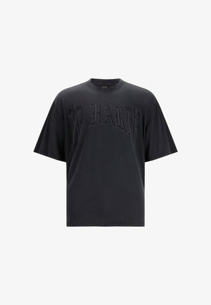 Black oversized t-shirt made from cotton, featuring a raised graphic print with the text "ED HARDY" in a gothic style across the front.