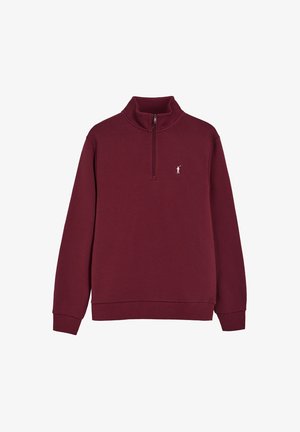 Bordeauxroter Pullover mit Viertelreißverschluss, hohem Kragen und kleinem weißem, gesticktem Golfer-Logo auf der linken Brust.