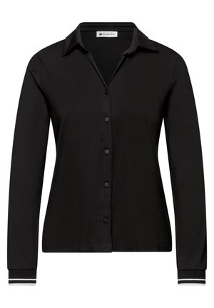 Chemise noire à manches longues boutonnée avec col, style ajusté et doubles rayures blanches sur les poignets.