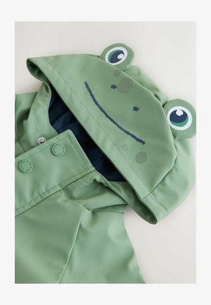 Zöld vízálló esőkabát, béka mintával, szemekkel és mosolygó szájjal. Patentgombok és sötétkék bélés belül.