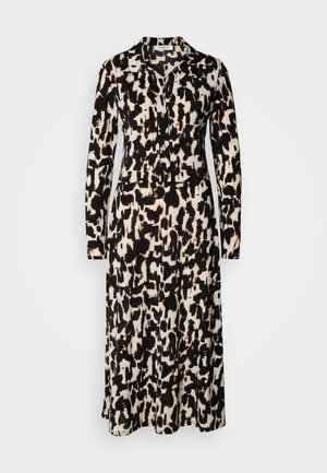 Langärmliges Kleid mit einem schwarz-beigen abstrakten Muster. Verfügt über einen kragenlosen Ausschnitt und Knöpfe vorne, aus leichtem Stoff gefertigt.