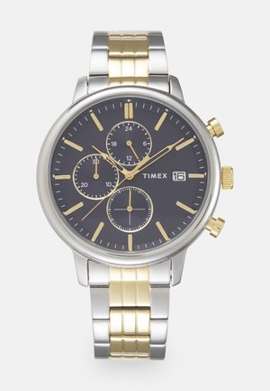 Zegarek chronograf Timex z czarną teksturowaną tarczą, stalową kopertą w kolorze srebrnym i złotym oraz bransoletą z metalu w dwóch kolorach.