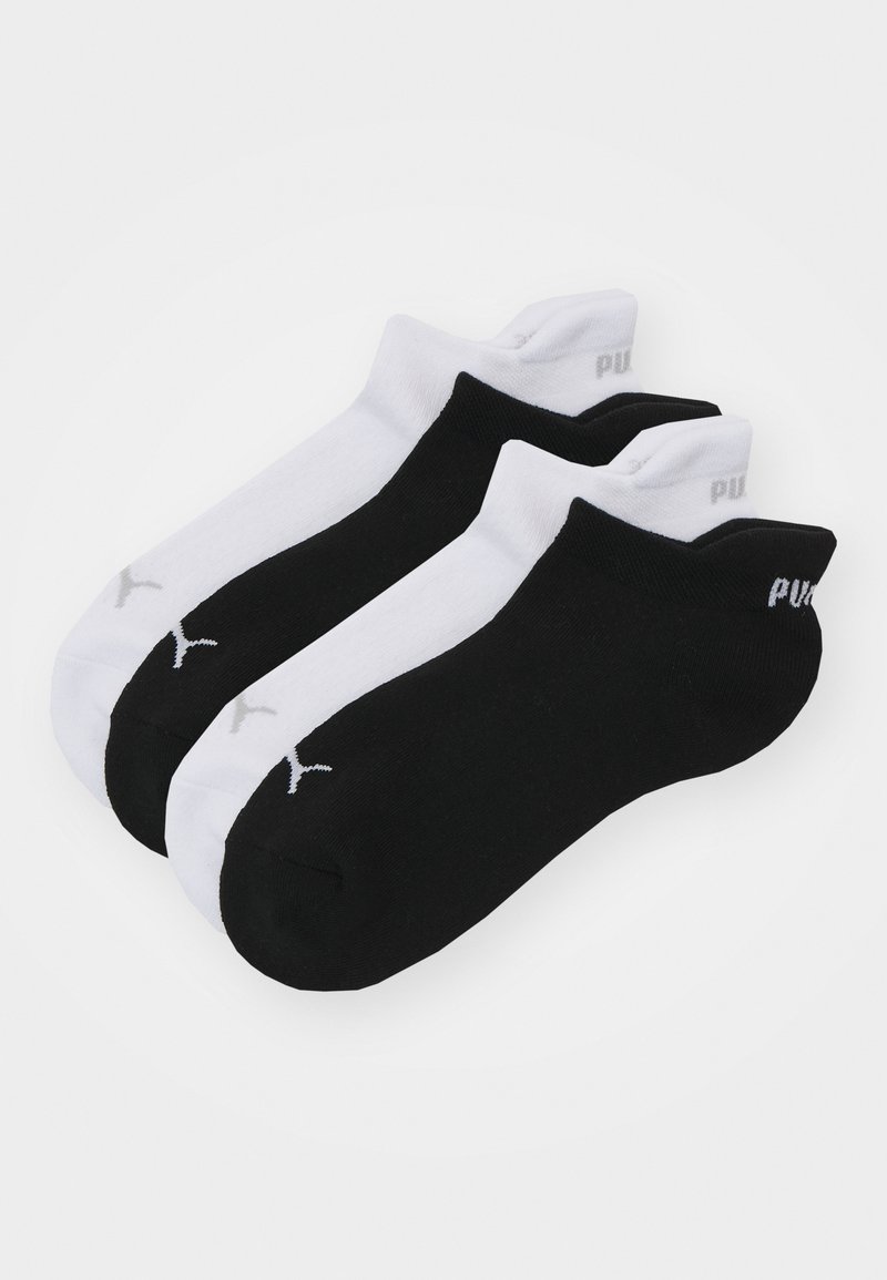 Trīs pāru potīšu zeķu komplekts melnā un baltā krāsā. Izgatavotas no kokvilnas, ar ribota tipa malām un logotipa akcentiem katra zeķes aizmugurē.