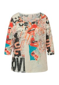 Chemise à manches 3/4 multicolore avec des graphiques de lèvres audacieux, des designs de texte, et un tissu léger avec une texture lisse. Encolure arrondie.