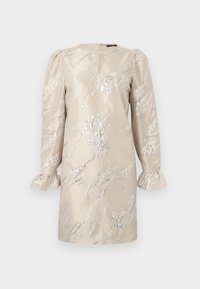 Bežinė suknelė su ilgomis rankovėmis, dekoruota sidabro raštais. Apvalus iškirpimas ir šifoninės apykaklės. Nugaros skeltukas palengvina dėvėjimą.