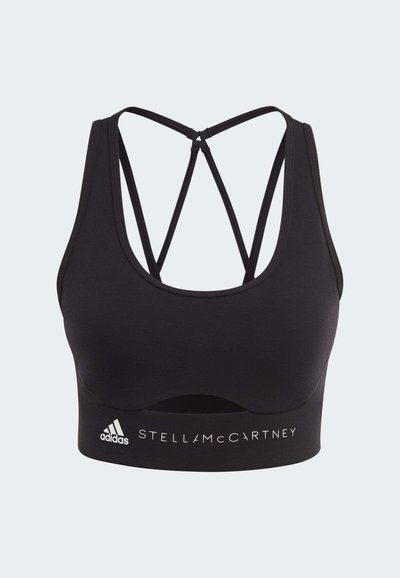 Black sports bra with crisscross thin straps and "Adidas Stella McCartney" printed on the band beneath the bust.