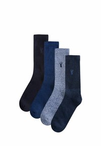 Vier Paare Socken in verschiedenen Blautönen, mit strukturierten und gerippten Designs, jeweils mit einem kleinen Logo.