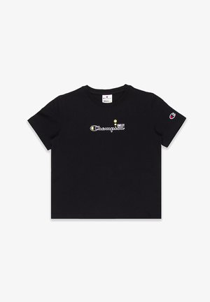 Schwarzes Baumwoll-T-Shirt mit Rundhalsausschnitt, versehen mit "Champion" und einem Smiley-Logo in Gelb und Weiß, kurzen Ärmeln und einem lässigen Schnitt.