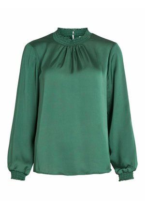 Blouse vert foncé à manches longues avec un col montant froncé et des poignets smockés sur les manches, fabriquée en tissu lisse.