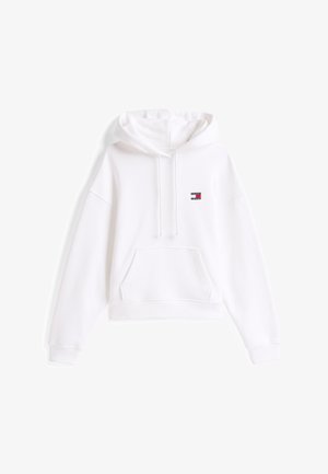 Valge lühendatud kapuutsiga sviiter, mis on valmistatud pehmest kangast. Omab eesmist taskut, nööriga kapuutsit ja väikest logotaskut rinnal. Tavaline lõige.