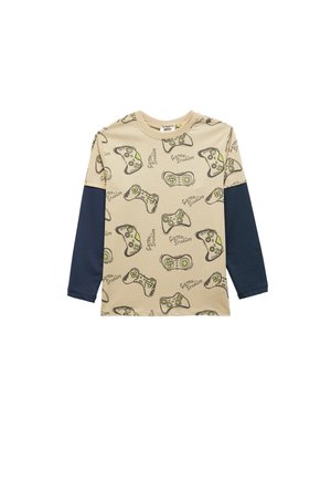 Beige pitkähihainen T-paita, jossa on peliohjaimen kuvioita, ja tummansinisiä hihoja. Pehmeä kangas, rento istuvuus.