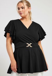 Top nero avvolgente con maniche a sbuffo, vita stretta con una fibbia dorata come accento, tessuto texture e design con orlo svasato.