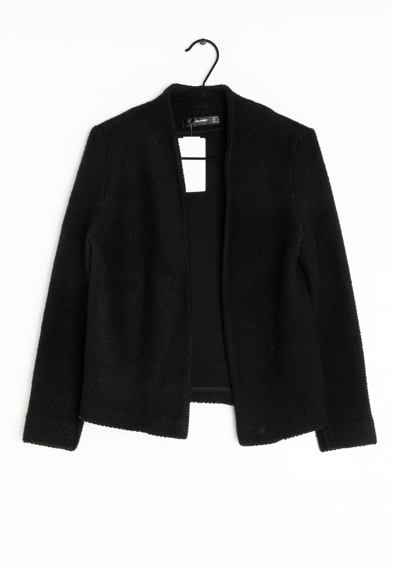 Black cardigan with a textured knit pattern, open front, and long sleeves. Hangs from a hook, tag visible on the neckline area.