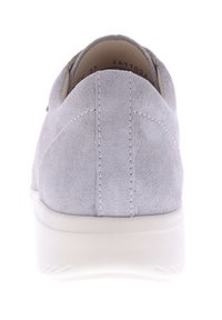 Gray suede shoe with a smooth texture, rounded shape, and white rubber sole; features stitching details on the heel.