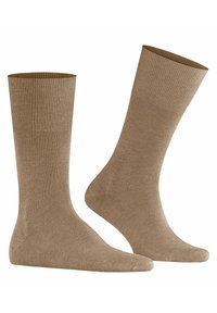 Beige Baumwollsocken mit einem gerippten Bündchen, glatter Textur und verstärktem Zehen- und Fersenbereich, entworfen für Komfort und Langlebigkeit.