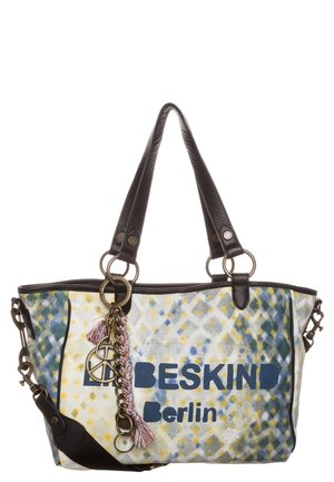 Lærredsnet med flerfarvede polkaprikker, sorte læderhåndtag, metal kæde og kvast, og "BESKIND Berlin" trykt på forsiden.