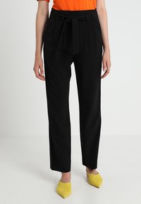 KIOMI Tygbyxor - black