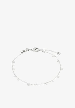 Delicate silver chain bracelet with small round disc charms evenly spaced and a lobster clasp closure with extender chain.
