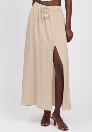 Maxinederdel i beige, lavet af let stof, med højt slid, elastisk taljebånd med snøre og træperledekorationer.