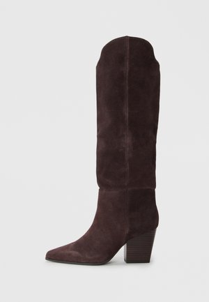 Knee-high suede boots in dark purple, featuring a pointed toe and a chunky wooden heel, with a smooth texture and minimalistic design.