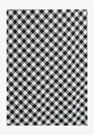 Mustvalge ruuduline kangas, millel on võrgu muster, ühtlase suurusega ruudud, tekstuuriga kude ja vastandlikud musta ja valge tooni.