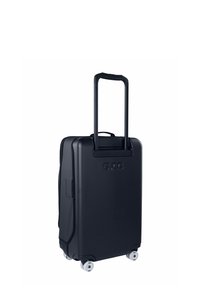 Valigia rigida in nero opaco, dotata di manico telescopico, quattro ruote e maniglia laterale. Logo impresso sul davanti.