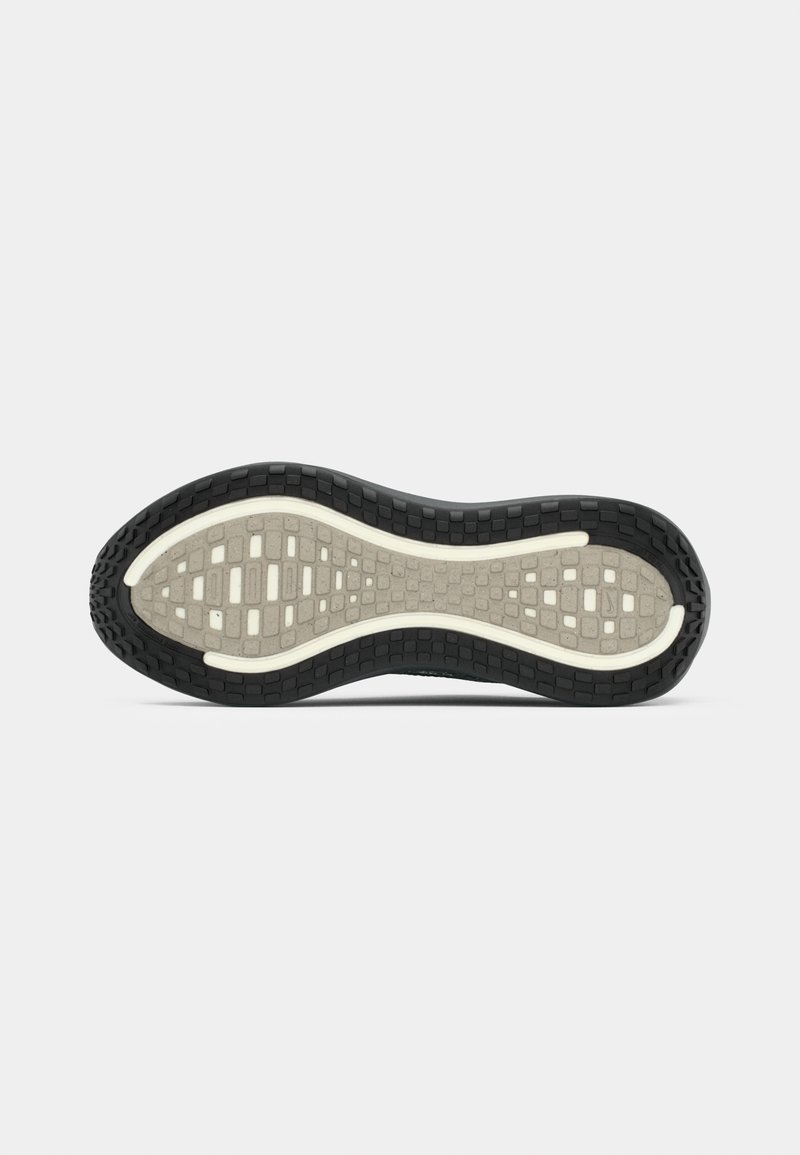 Sole of a running shoe in black and gray with a textured grip pattern, designed for traction and durability.