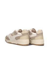 Beige sneakers with a combination of mesh and suede material. Features a white logo, rubber outsole, and a padded collar for comfort.