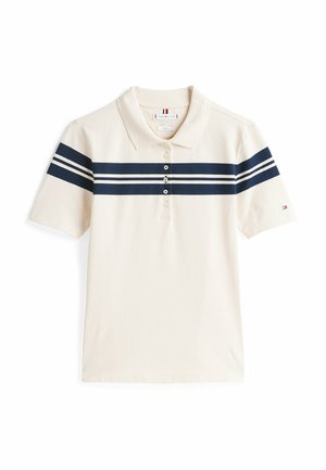 Beżowa koszulka polo wykonana z bawełny, z granatowym paskiem na klatce piersiowej i trzema guzikami. Krótkie rękawy.