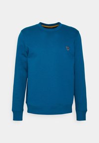 Blauwe sweatshirt van zachte stof, met een ronde hals en lange mouwen. Het heeft een klein geborduurd ontwerp op de linkerbovenkant.