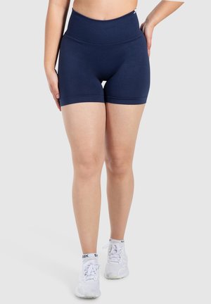 Donkerblauwe high-waisted shorts gemaakt van rekbaar materiaal. Heeft een gladde textuur en een strakke pasvorm, die eindigt halverwege de dij.