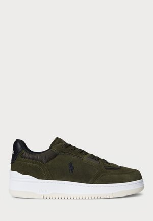 Green suede sneaker with black mesh and leather accents, white rubber sole, rounded shape, and embossed logo on the side.