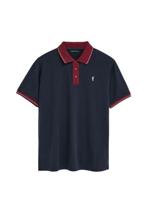 Polo de manga corta en azul marino con cuello burdeos, tapeta de botones, puños de las mangas y un pequeño logo bordado de un golfista en blanco en el pecho.