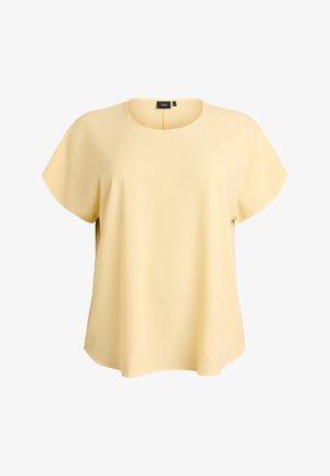 Helekollane lühikeste varrukatega pluus, mis on valmistatud tekstureeritud kangast. Omab ümmargust kaelust ja lahtist, mugavat lõiget küljetõmmetega.