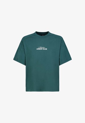 Teal oversized short-sleeve t-shirt with white "Athletics Urban Club" text printed on the chest, crew neckline, and relaxed fit.