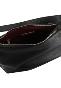 Black leather bag with a textured surface, gold zipper, and a dark maroon interior. The bag has a wide opening for accessibility.