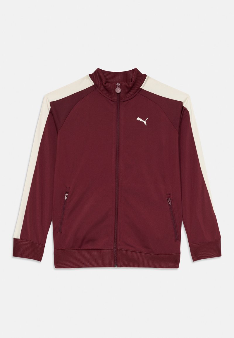 Bordowa kurtka zapinana na zamek z kremowymi akcentami, wysoki kołnierz, boczne kieszenie i ściągacze na mankietach. Posiada logo Puma na lewej piersi. Gładka faktura materiału.
