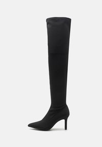Black over-the-knee boot made of smooth fabric with a pointed toe and a thin, high heel. Seamless design extends to the top of the leg.