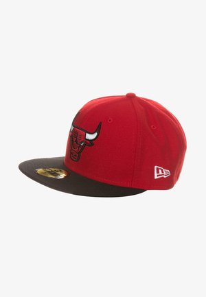 Red baseball cap with a black visor, featuring a stitched Chicago Bulls logo on the front and a small New Era emblem on the side.
