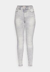 Smala jeans i en ljusgrå tvätt, hög midja, fem fickor och klassisk metallknappdetalj. Avslutade med en slät yta.