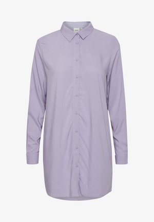 Dlhé rukávy, levanduľová košeľa na gombíky z ľahkého materiálu, s klasickým golierom, gombíkovým zapínaním a mierne zakriveným lemom.