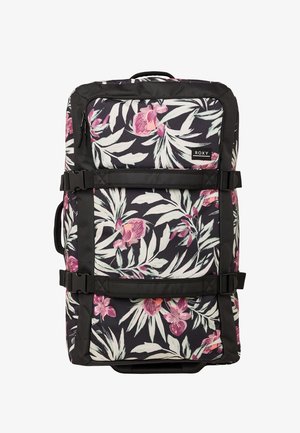 Walizka na kółkach na czarnym tle, z różowo-białym kwiatowym wzorem, poziomymi pasami ściskającymi oraz metką marki Roxy na przedniej kieszeni.