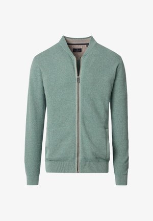 Grüne Strick-Bomberjacke mit strukturiertem Muster, durchgehendem Reißverschluss, gerippten Bündchen und zwei Seitentaschen. Leichtes Gewebe, ideal zum Schichten.