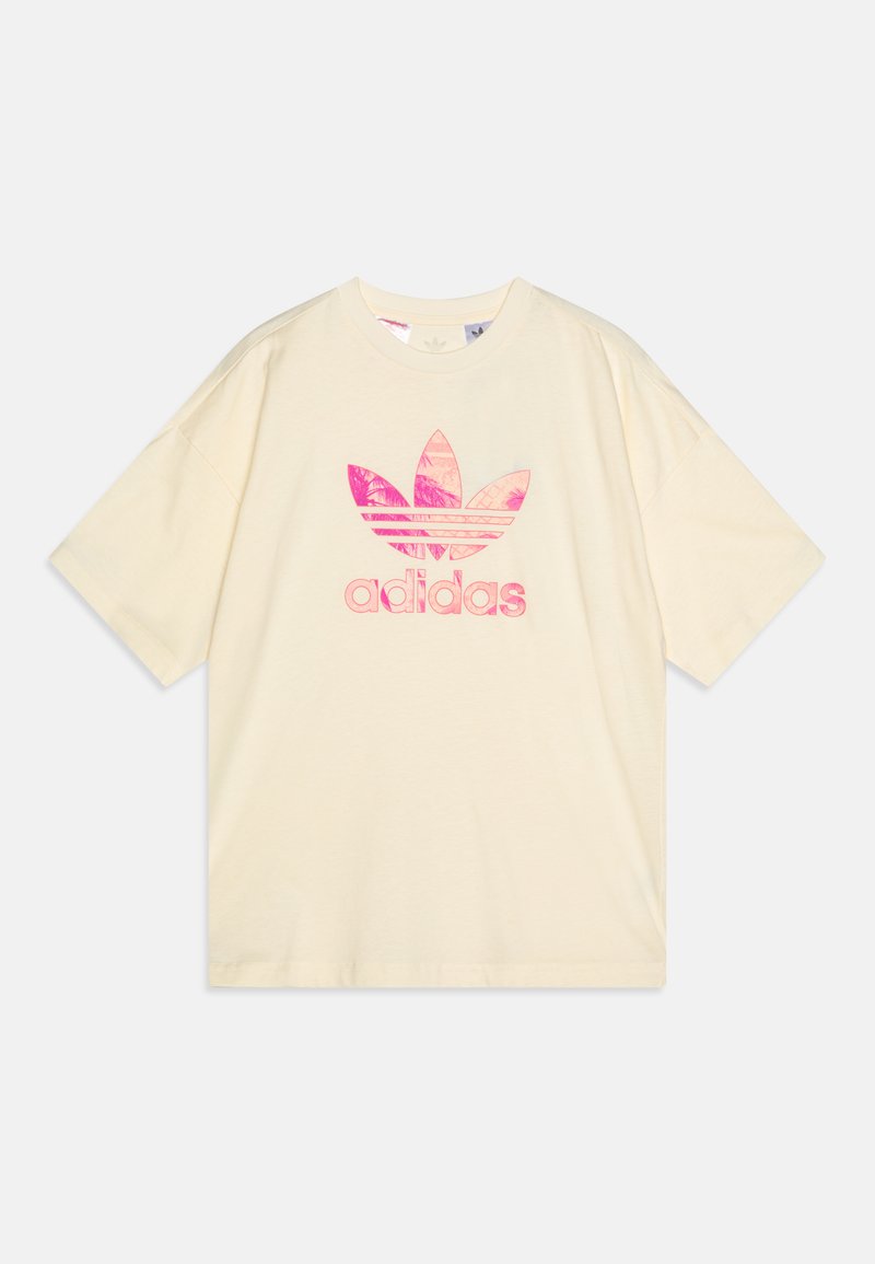 T-shirt de algodão em cor creme com um logótipo adidas estilizado em rosa com padrões de folhas, mangas curtas e um corte descontraído.