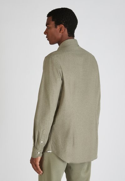 Lange mouwen shirt in licht olijfgroen, gemaakt van textiel met een structuur. Heeft een kraag, knopenmanchetten en een afgeronde zoom.