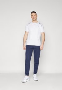 Lacoste Sport TROUSERS TAPE - Treniņtērpa apakšdaļas - navy blue