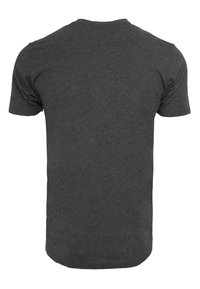 Gray cotton t-shirt with a round neckline, short sleeves, and a smooth texture. Displays a solid color with no patterns or designs.