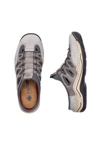 Gray suede shoes with elastic lacing, featuring cut-out side panels and a rubber sole. Inner lining in red offers added comfort.