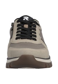 Beige athletic shoe with a combination of suede and mesh materials, black laces, and a textured brown rubber sole. Features a side zipper.