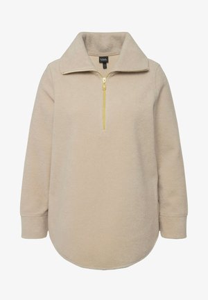 Beżowy polarowy sweter z kołnierzem na zamek półwytrzymującym oraz złotym detalem zamka. Posiada długie rękawy i zaokrąglony dół; miękka tekstura.